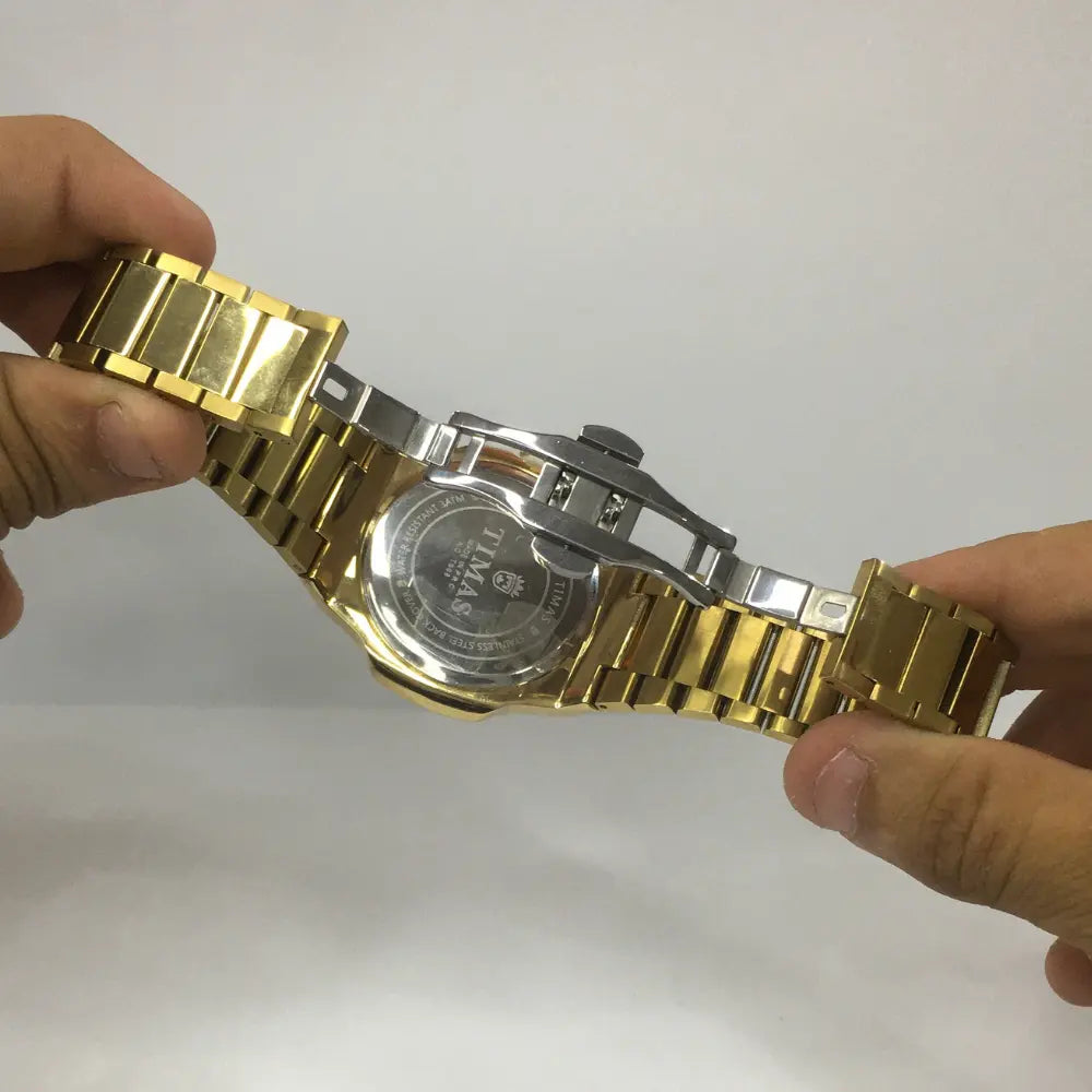 T.M Elegant Stainless Steel Watch Black golden And Silver | Premium Quartz Timepiece⌚